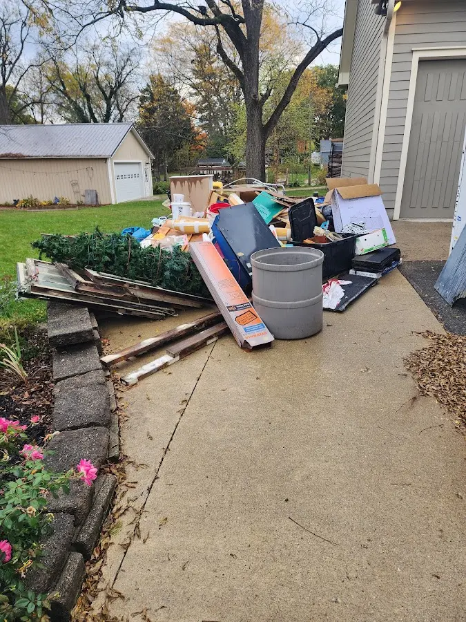 Dumpster being loaded with debris for Estate Cleanout Dumpster Rental in Richton Park